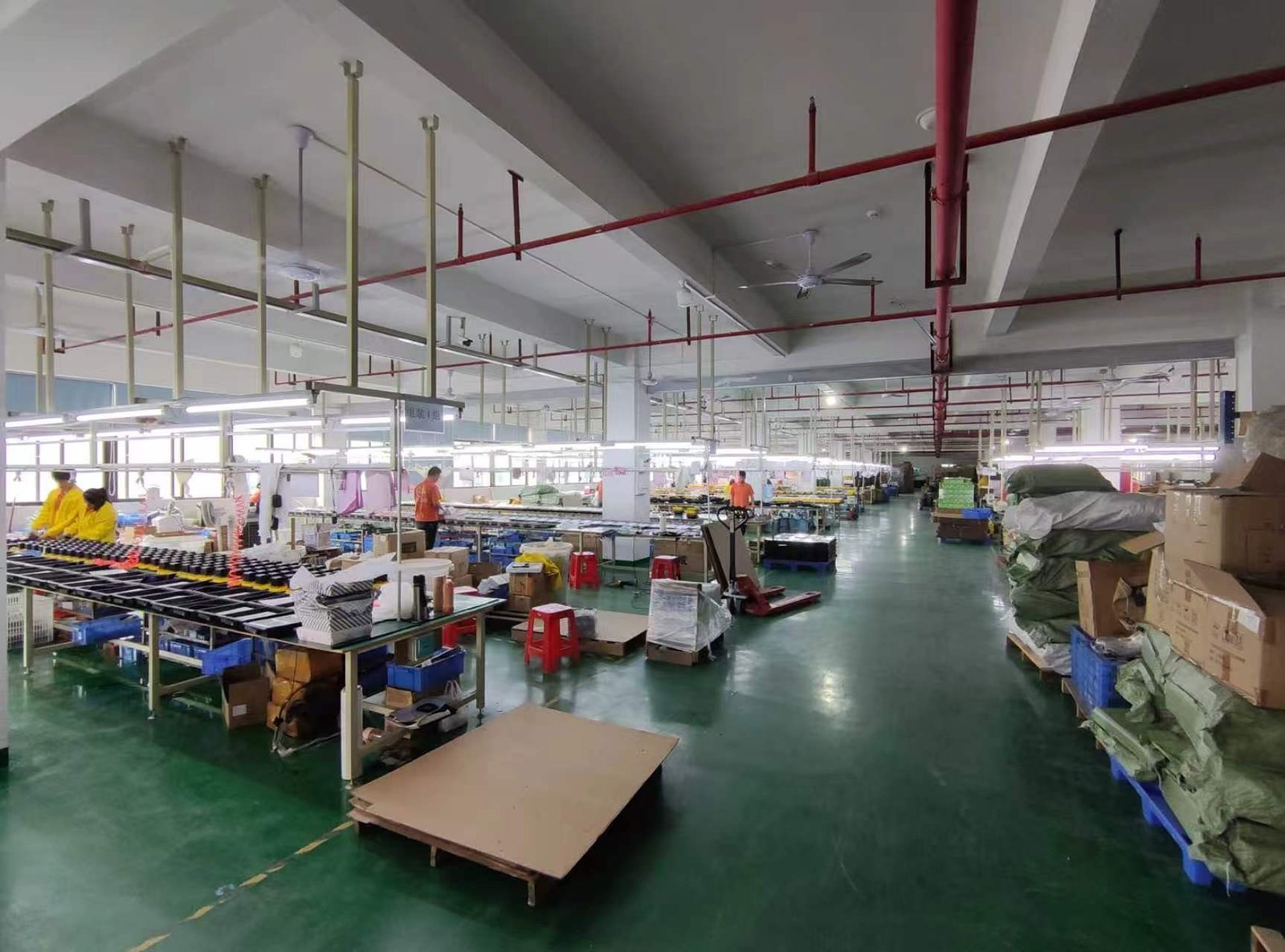 The Shengjia Lighting production floor with workstations and factory staff.